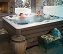 Couple enjoying their outdoor hot tub